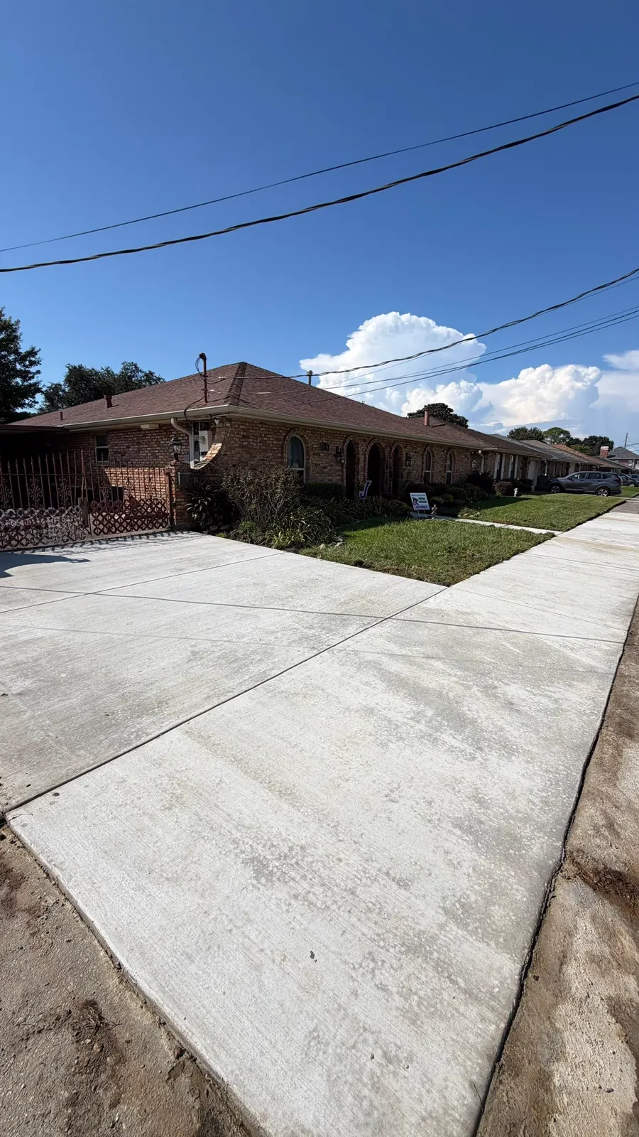 Completed concrete driveway replacement at a Metairie home