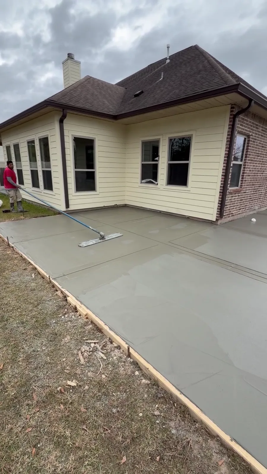 Fresh SCS concrete addition around the back of a home in Madisonville