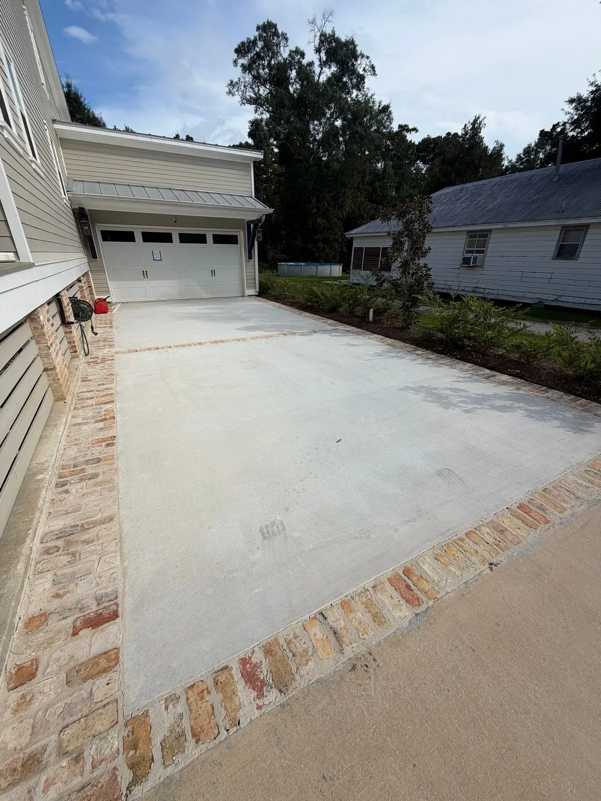 SCS concrete driveway with Chicago brick borders